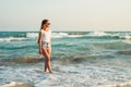 Girl on the background of the sea sunset