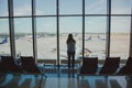 Girl with a backpack at the airport window Sheremetyevo Royalty Free Stock Photo