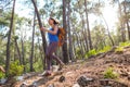 A girl with a backpack goes along a mountain trail Royalty Free Stock Photo