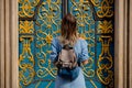 Girl with a backpack standing near a beautiful door