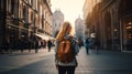 Girl with backpack travelling in the city