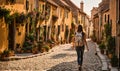 Girl with backpack walking on cobblestone street