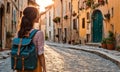 Girl with backpack walking on cobblestone street