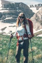 Girl backpacker hiking in mountains