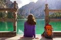 Girl backpacker looking at Braies lake