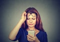 Girl with bad vision using smartphone Royalty Free Stock Photo