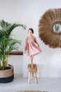 Girl balancing on one leg while standing on a stool Royalty Free Stock Photo