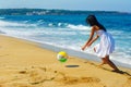 Girl and a ball on the beach Royalty Free Stock Photo