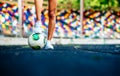 Girl with ball workout on the stadium