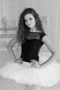 Girl ballerina with curly hair. Black and white photo. BW