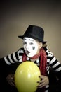 Girl with a balloon in the form of mime actor Royalty Free Stock Photo