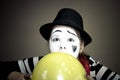 Girl with a balloon in the form of mime actor Royalty Free Stock Photo