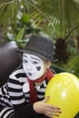 Girl with a balloon in the form of mime actor Royalty Free Stock Photo