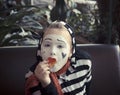 Girl with a balloon in the form of mime actor Royalty Free Stock Photo