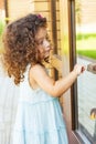 Girl bangs in a closed door Royalty Free Stock Photo