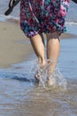 Girl barefoot is walking on the waves Royalty Free Stock Photo