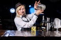 Girl barman makes a cocktail in the public house Royalty Free Stock Photo