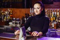 Girl bartender at the bar