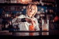 Girl bartender concocts a cocktail at the beerhouse Royalty Free Stock Photo