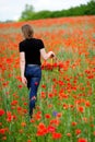 girl with basket on the poppy field Royalty Free Stock Photo