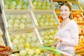 Girl with basketful vegetables