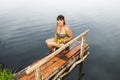 Girl in a bathing suit with a bunch of water lilies Royalty Free Stock Photo