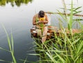 Girl in a bathing suit with a bunch of water lilies Royalty Free Stock Photo