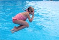Girl jumping in a open swimming pool Royalty Free Stock Photo