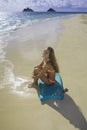 Girl on the beach with boogie board Royalty Free Stock Photo