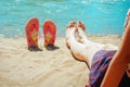 Girl on the beach with flip flops Royalty Free Stock Photo