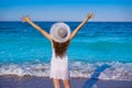 Girl with beach hat in sea open arms Royalty Free Stock Photo