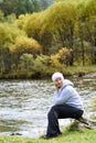 Girl on beach. Mountain river. Autumn forest Royalty Free Stock Photo