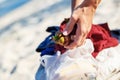 Girl on the beach in Thailand holding a fruit mangosteen