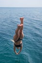 Girl plunging into deep sea water