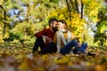 Passionate love in the autumn park. Young couple