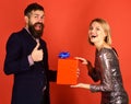 Girl and bearded man with happy faces and gift box Royalty Free Stock Photo