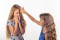 Girl beats her sister`s jabber Royalty Free Stock Photo