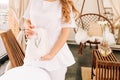 a girl beautician in a white suit stands in a beauty salon near the couch, horizontal image Royalty Free Stock Photo