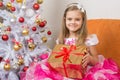 Girl in beautiful dress gave New Year gift Royalty Free Stock Photo