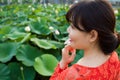 Girl in beautiful dress at lotus lake