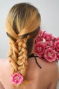 A girl with a beautiful hairdress with a bouquet of tulips is a sort of Columbus Royalty Free Stock Photo