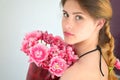 A girl with a beautiful hairdress with a bouquet of tulips is a sort of Columbus Royalty Free Stock Photo