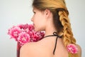 A girl with a beautiful hairdress with a bouquet of tulips is a sort of Columbus Royalty Free Stock Photo