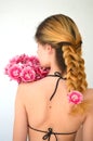 A girl with a beautiful hairdress with a bouquet of tulips is a sort of Columbus Royalty Free Stock Photo