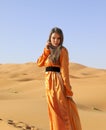 A girl in a beautiful Moroccan dress. Merzouga Morocco Royalty Free Stock Photo