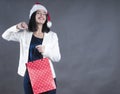 Girl beauty with braces a cap santa gift bag Royalty Free Stock Photo