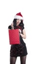 Girl beauty with braces a cap santa gift bag surprise Royalty Free Stock Photo