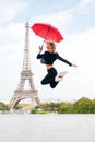 Girl with beauty look at eiffel tower. Woman jump with fashion umbrella. Parisian isolated on white background. Happy Royalty Free Stock Photo