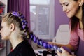 Girl in the beauty salon is weaved with braids. braided pigtails. Royalty Free Stock Photo