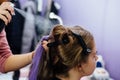 Girl in the beauty salon is weaved with braids. braided pigtails. Royalty Free Stock Photo